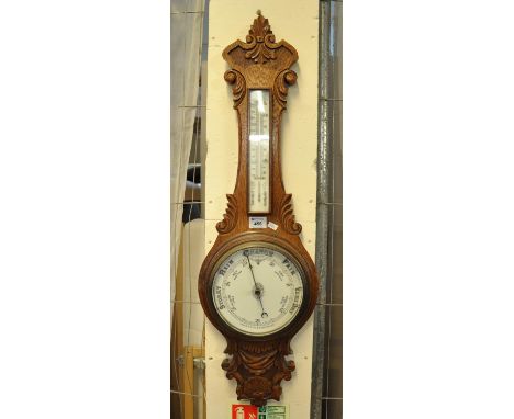 Early 20th Century carved oak wheel barometer.(B.P. 21% + VAT) 