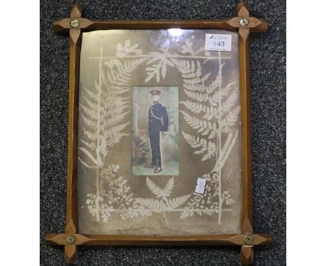 Retouched original photograph of a young army officer in dress uniform, within foliate mount and pine frame.(B.P. 21% + VAT) 