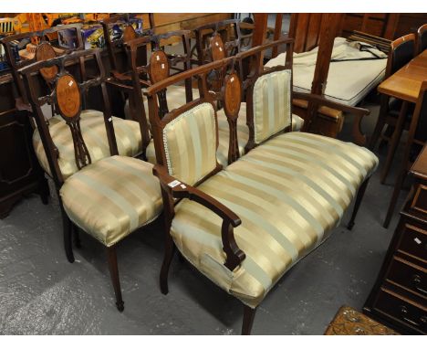 Edwardian mahogany inlaid and mixed woods parlour suite comprising five chairs (two open arm dining chairs) and a two seater 