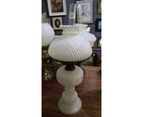 Opaque glass oil lamp with wrythen white glass shade and clear chimney.(B.P. 21% + VAT) 