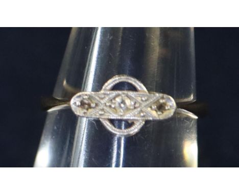 18ct gold three stone Art Deco diamond ring. Approximate weight 2.4 grams. (B.P. 21% + VAT) Ring size K 1/2