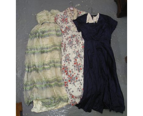 Three vintage dresses to include; 40s faille blue shirtwaister dress with label 'R.M.H.O 494', 50's floral dress and a strapl