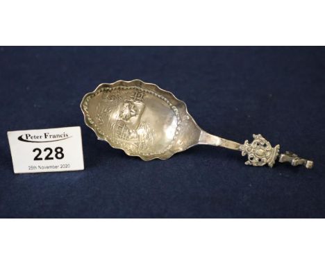 Silver caddy spoon in Dutch style with decoration to the bowl of a milkmaid and cow. Sheffield hallmarks. 0.7 troy ozs approx