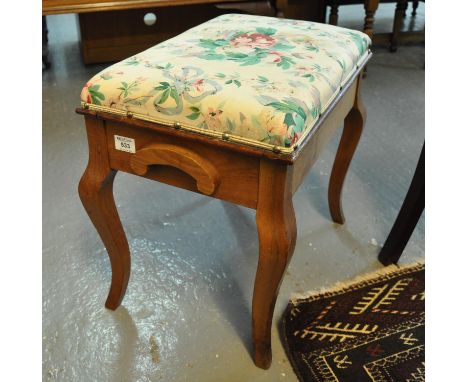 Early 20th Century oak upholstered floral piano stool.(B.P. 21% + VAT) 