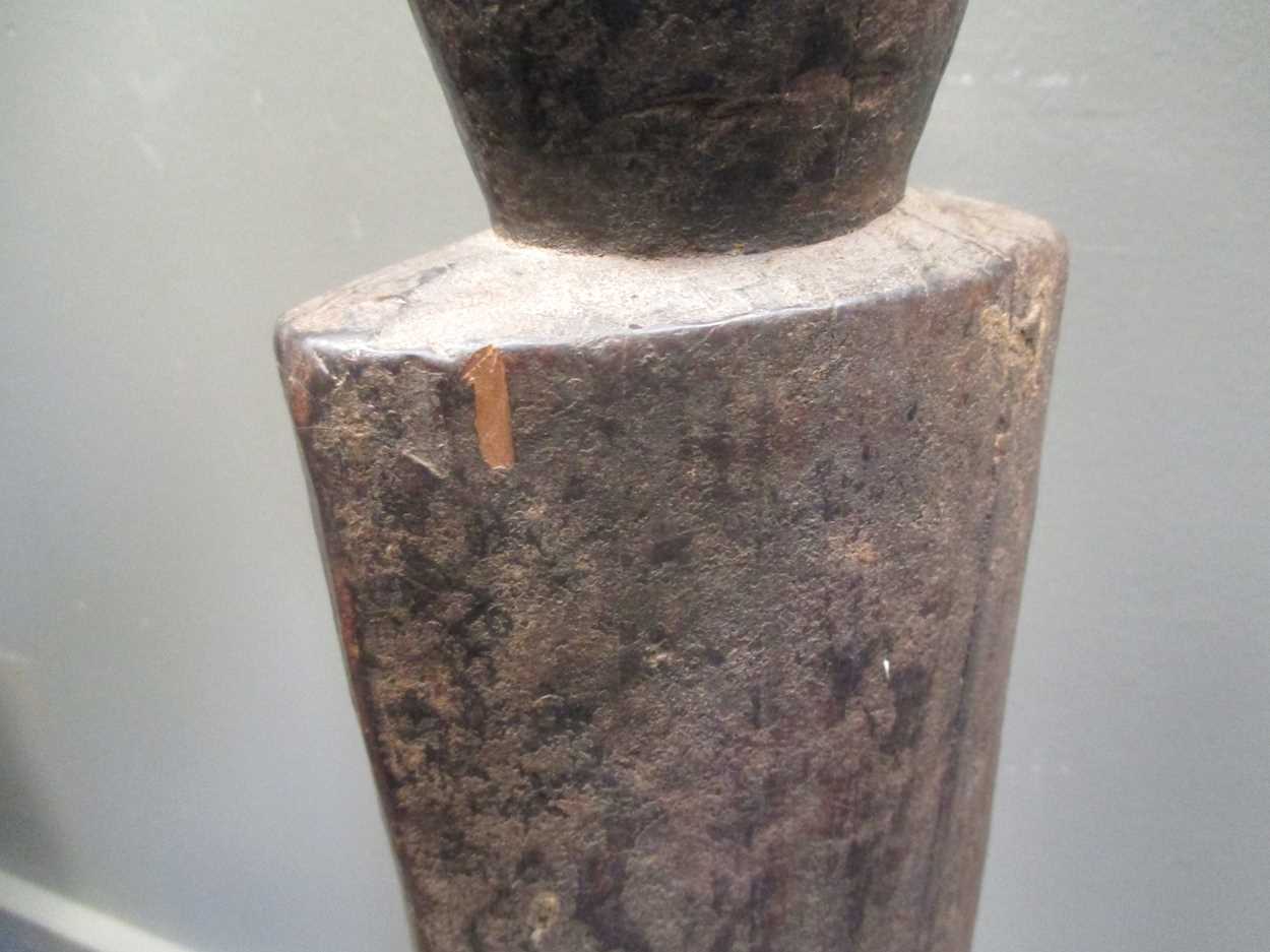 An early 20th century African carved wood fertility statue of phallic