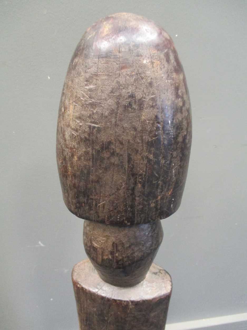 An early 20th century African carved wood fertility statue of phallic