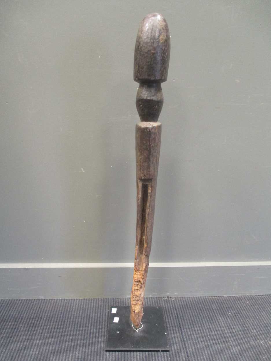 An early 20th century African carved wood fertility statue of phallic