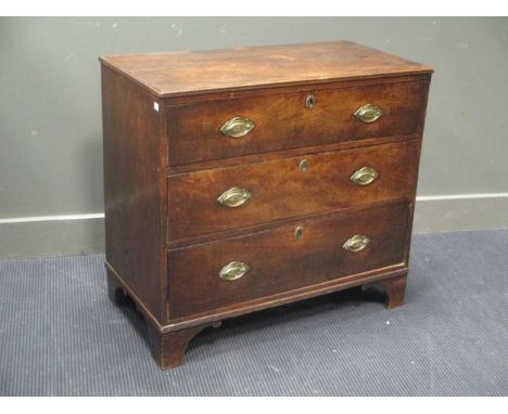 An early 19th century mahogany and elm chest of three long drawers on bracket feet 77 x 84 x 43cm