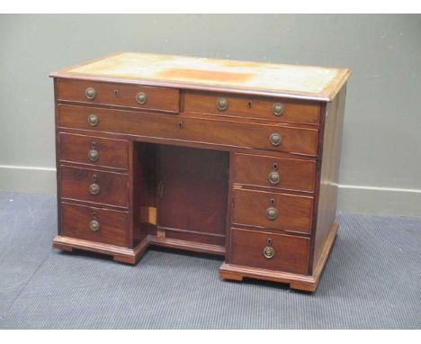 A 19th century mahogany kneehole desk of nine drawers, the bracket feet possibly reduced in size 82 x 105 x 70cm