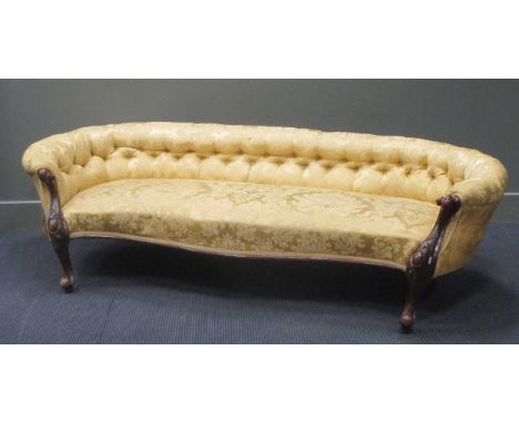 A Victorian showframe sofa, with button back and serpentine shaped front seat