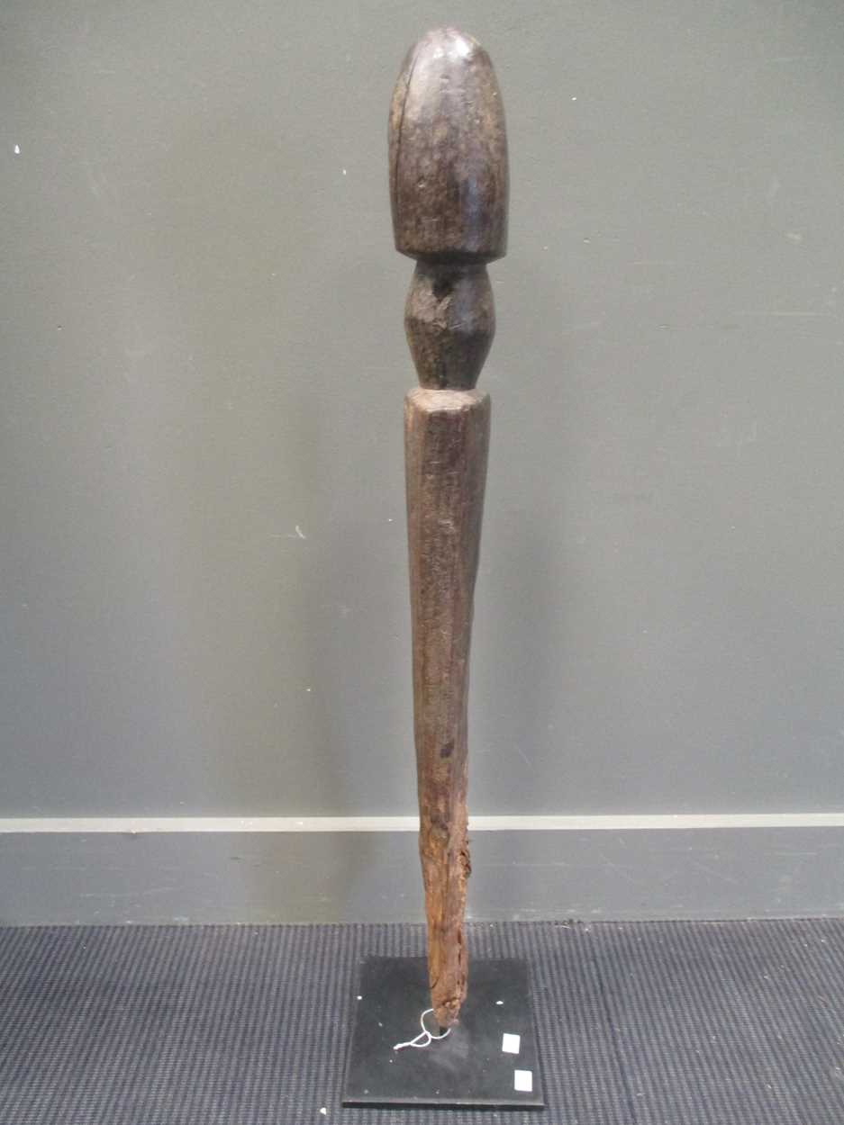 An early 20th century African carved wood fertility statue of phallic