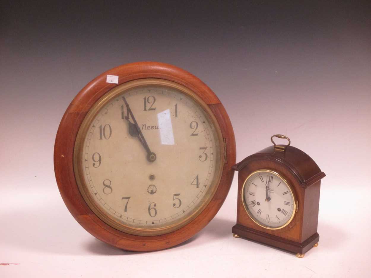 A modern mantle clock by Comitti in mahogany case 24cm high and a wall clock with hes movement