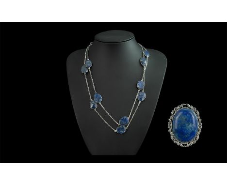 Lapis Lazuli Necklace &amp; Brooch, comprising a long Lapis Lazuli necklace of oval discs on a silver tone chain, and a match