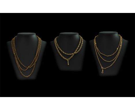 Three Rolled Gold Chains, including two fob chains, and a long chain.