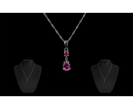 9ct Gold Double Drop Pink Topaz Pendant, in white gold.  Pendant suspended on a white gold 18" chain.  All fully hallmarked.