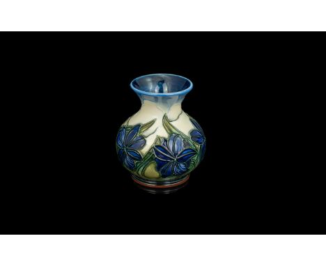 W. Moorcroft Small Vase. Blue &amp; White Background with Blue Flowers and Green Stems. Approx 4 Inches High. Very Good Condi