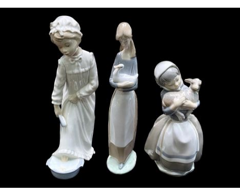Three Nao Figures, comprising a Nao by Lladro A3500 Girl In Apron Holding Duck 11" tall.  Nao by Lladro figure Girl Holding L