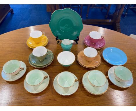 Collection of Royal Stuart Spencer Stevenson Colourful Porcelain, comprising four cups, saucers, and side plates in green, pi