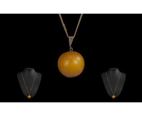 Antique Period Large 9ct Gold Mounted Butterscotch Amber Bead/Pendant Drop, marked 9ct.  Attached to a later 9ct gold chain (