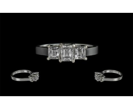 18ct White Gold - Excellent 3 Stone Emerald Cut Diamond Ring. Marked 750 - 18ct to Interior of Shank. The 3 Step-Cut Diamonds