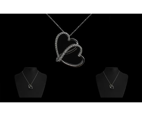 18ct White Gold Diamond Heart Shaped Pendant suspended on a fine box link chain.