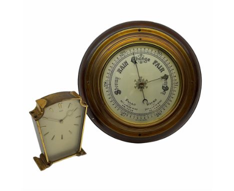 A mid-20th century  hall barometer with a compensated Aneroid movement, sixteen-centimetre silver painted dial measuring baro