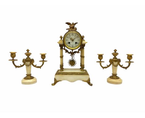 A late 19th century French portico clock with a pair of matching double light candelabra, eight-day outside countwheel moveme