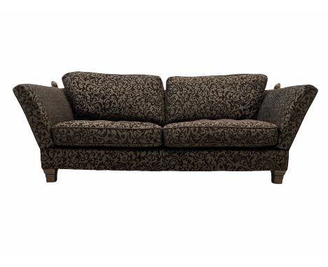 Contemporary Knole type three seat drop arm sofa, upholstered in brown fabric with raised foliate pattern Dimensions: Height: