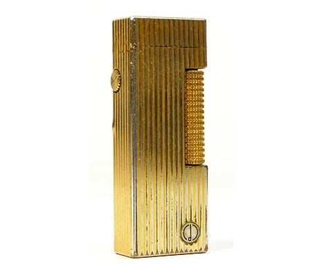 Dunhill, a gold plated Rollagas lighter, with linear engraved decoration. 