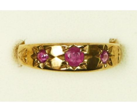 A 9ct rose gold Edwardian style three stone ruby ring, P, 3gm 