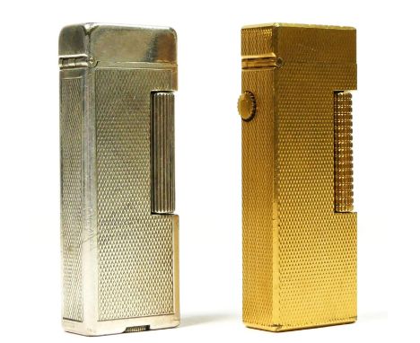 Dunhill, a gold plated Rollagas lighter and a silver plated example (2). 