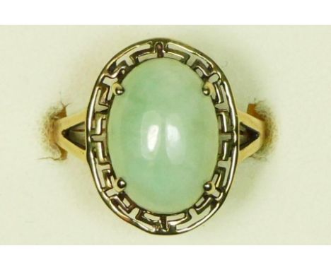 A 9ct gold and cabochon jade dress ring, 14 x 10mm, openwork frame, N, 3.4gm 