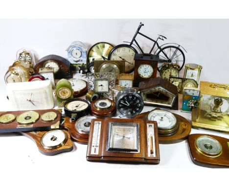 A collection of mantel clocks, alarm clocks and wall barometers, having manual wind and quartz movements. (4) 