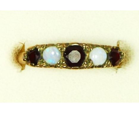 A 9ct gold opal and garnet five stone ring, carved claw set, M, 2.5gm 