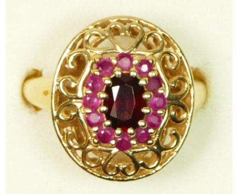 A 9ct gold garnet bordered by rubies cluster ring, 19 x 16mm, Q, 5gm 