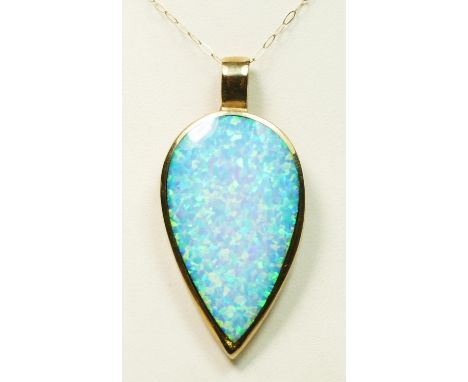 A 9ct gold mounted opal doublet pear shape pendant, stone 35 x 22mm, chain, 7.4gm 