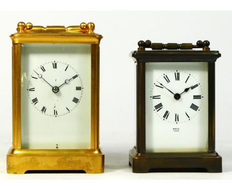 A French 8 day brass carriage clock, enamelled dial with roman numerals, together with an English example.13cm tall. (2) 