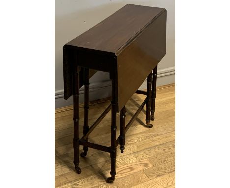 A mahogany faux bamboo gate leg drop leaf table, turned legs on castors, 76cm x 71cm x 26cm 