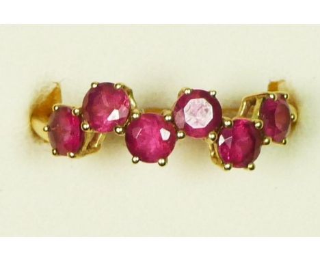 A 9ct gold and six red tourmaline set ring, S, 1.6gm 