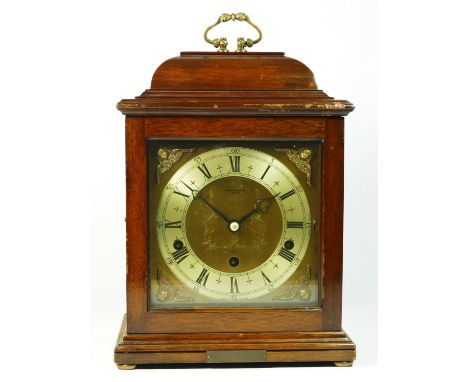 A mahogany cased bracket clock by Elliott, retailed by Arthur Saunders of London, having 8 day movement striking on gongs, 30