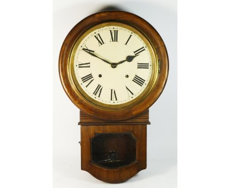 An oak cased drop dial wall clock, manual movement striking on gong, with pendulum and key.53cm long. 