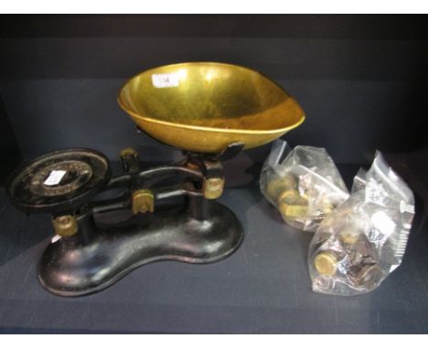 A set of vintage kitchen scales and weights, branded for Boots, Nottingham