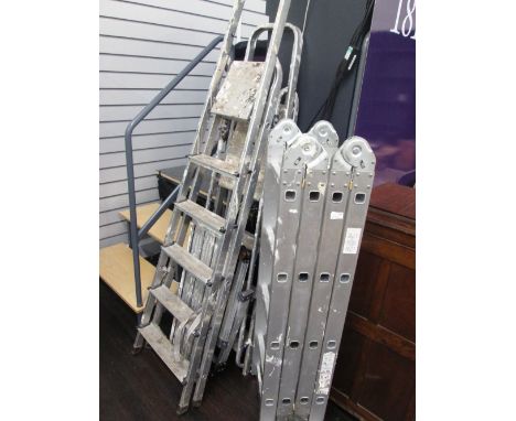 A set of aluminium folding ladders and two sets of step ladders