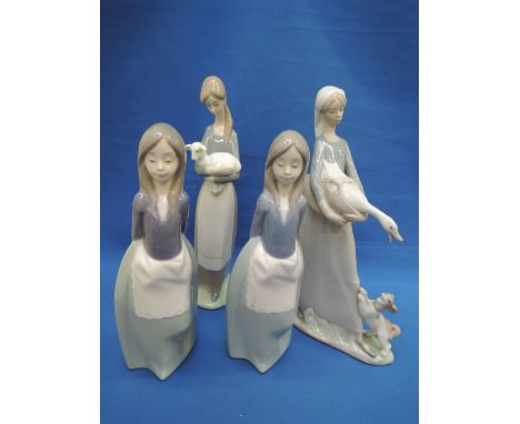 Two Lladro figurines, Girl with duck and dog and Girl  with lamb along with two Nao figurines, girls wearing aprons