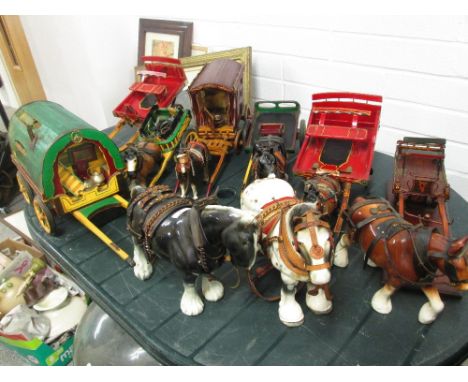 Seven decorative wooden carts and caravans with ceramic horses in harness