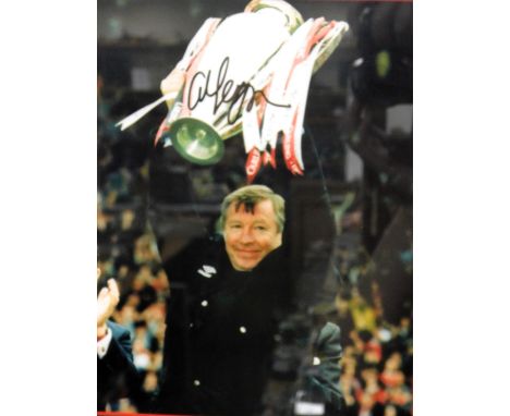 A signed photo print of Alex Ferguson, holding the European Cup aloft, signed, framed and glazed, 46cm x 40cm. 