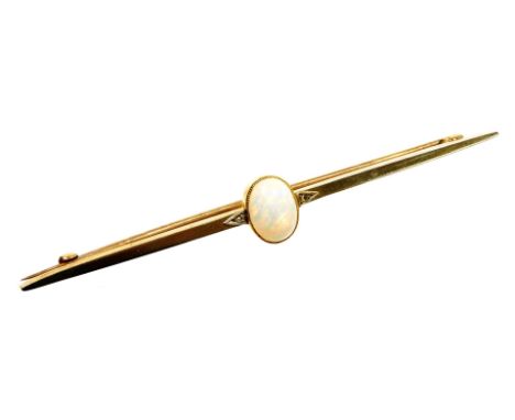 An opal bar brooch, the oval cabochon opal flanked by two tiny diamonds, in a yellow metal setting, 5.2g.