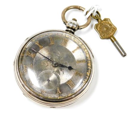 A Victorian gentleman's silver cased pocket watch, open faced, key wind, circular silver dial with engraved floral decoration