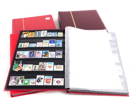 Philately. British, European and world stamps, definitives and commemoratives, mint and used, in four albums. 