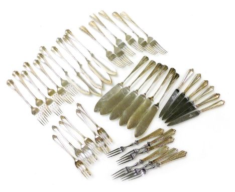 A group of silver plated flatware, comprising a set of six fruit knives and forks with stainless steel blades and prongs, six